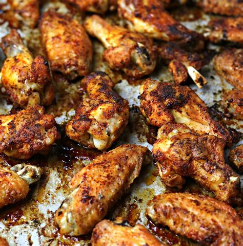 Here’s the step-by-step to knock these grilled wings out of the park every time you make ‘em. Step 1. Prepare the grilled chicken wings recipe. Preheat the grill to 425°F. Lay wings out flat on paper towel and pat them dry. Step 2. Season chicken wings. Mix together the garlic powder, salt, and pepper.